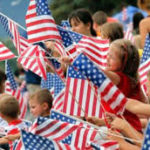 kids waving flags for parade