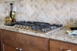 herringbone pattern travertine backsplash