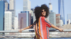 Portrait of smiling woman with Manhattan skyline