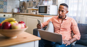 Young man working in his home office