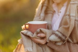 cup-sunset-hand-young-girl-covered-with-blanket